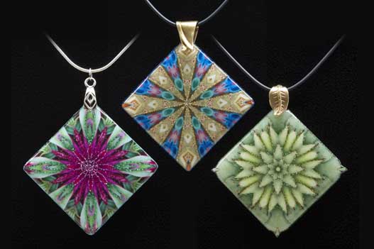 The kaleidoscopes for these pendants were printed on fabric, then covered with clear epoxy resin.